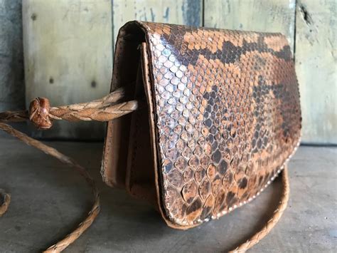 acquire a snakeskin purse.